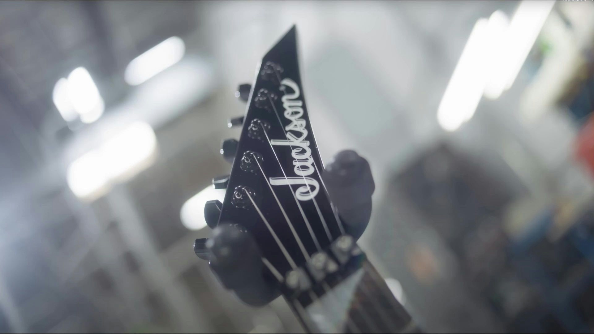 Jackson American Series Soloist campaign video showing the different blue, green, white, and black guitars of the series