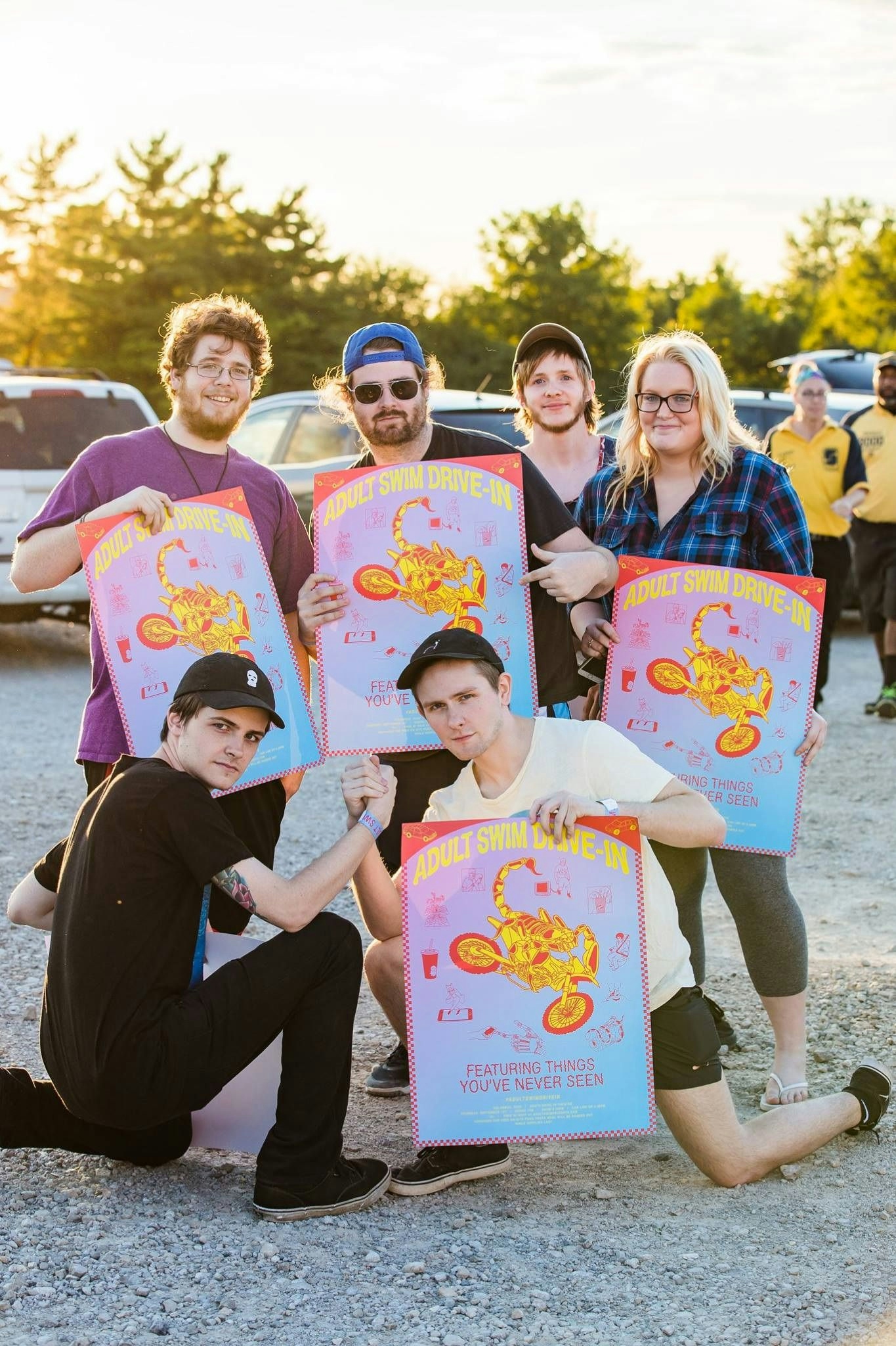 Adult Swim Drive-In event guests holding merchandise
